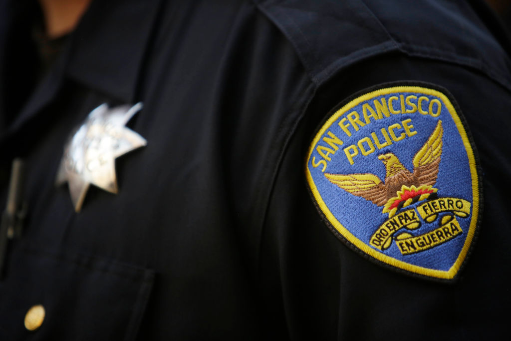 A San Francisco Police patch is seen on the uniform of an officer as he stands with members of the board of directors, members of the association and members of the community while Martin Halloran (not shown), San Francisco Police Officers Association pre