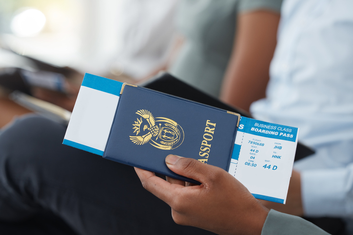 Travel, passport and man with ticket for business, information for airplane and journey for work at airport. Hands of worker with documentation for corporate and executive trip for professional job