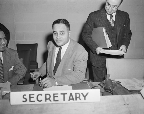 Ralph Bunche Sitting at Table