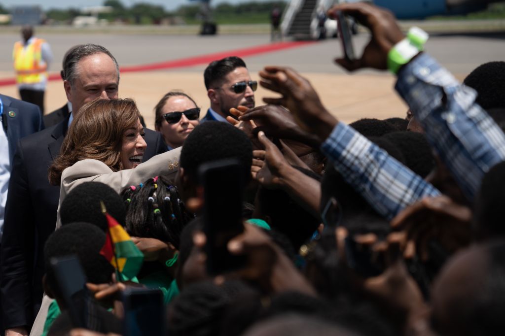 U.S. Vice President Kamala Harris waves upon her arrival at the Kotoka