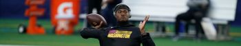 Dwayne Haskins family wife partial settlement blackmail robbery
