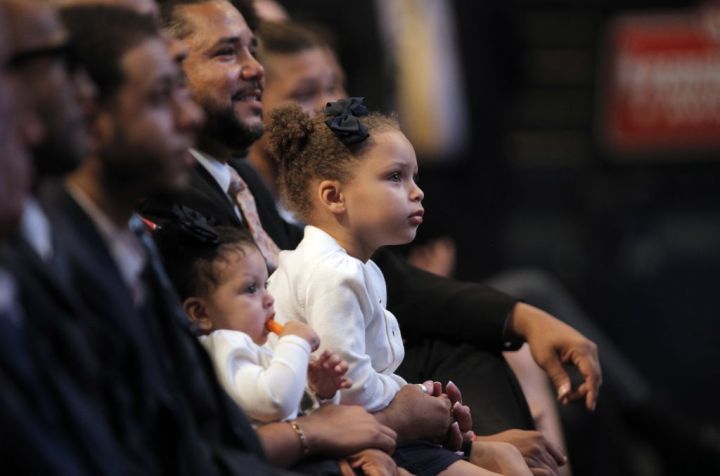 Riley Curry and little sister Ryan watch as Steph is awarded MVP