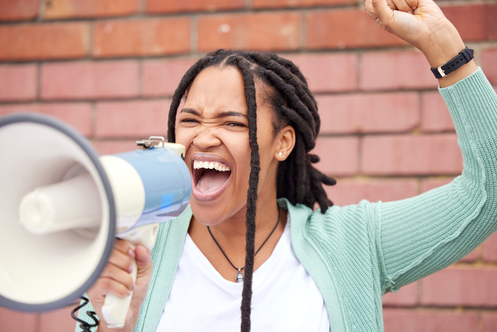 Speaker, protest or angry black woman with speech announcement for politics, equality or human rights. Young feminist leader, stop or loud gen z girl shouting for justice or help on wall background