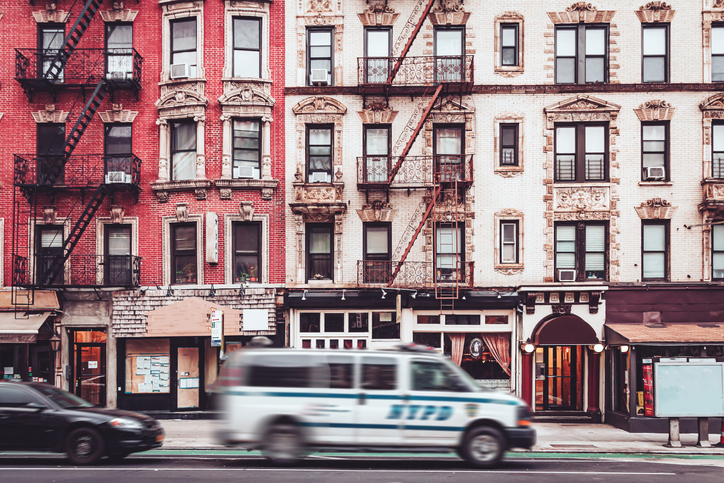NYPD police van moving through the streets of SoHo neighborhood in Manhattan, New York.