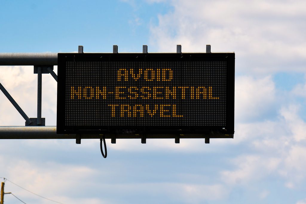 An overhead highway sign warns