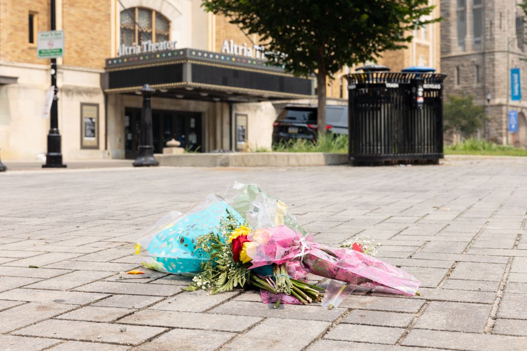 Flowers left at the site of a fatal shooting