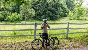 Mountain Biker Is Riding A Bicycle In The Countryside