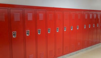 close up on red lockers in the school