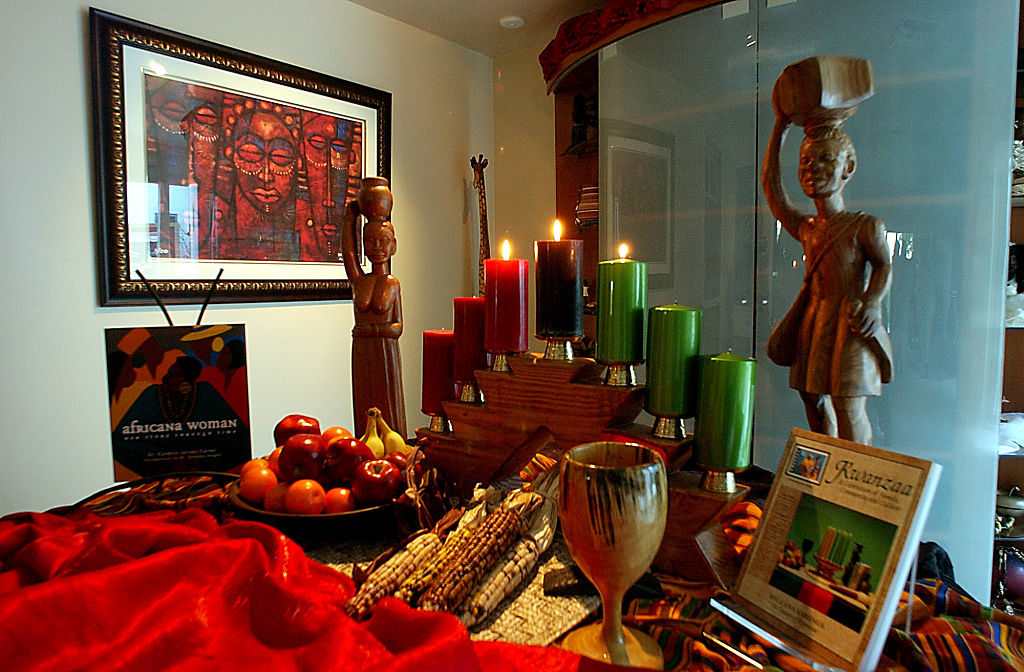 Dawn Sutherland celebrates Kwanzaa with friends at her home, Sunday afternoon in Baldwin Hills. Her