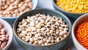 Different types of legumes in bowls - black-eyed peas