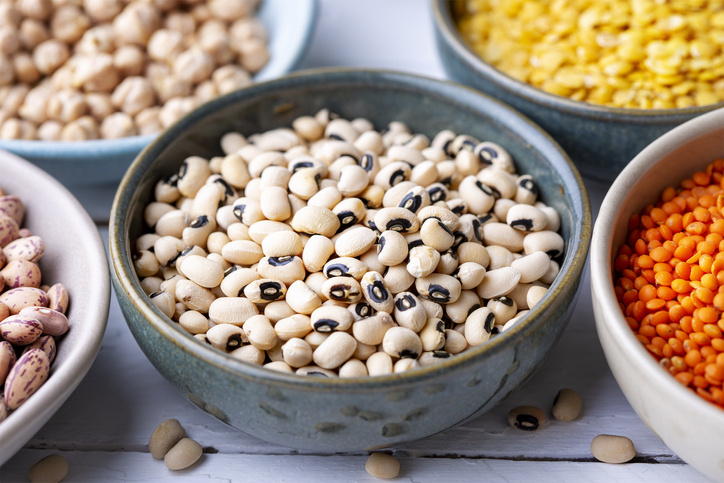 Different types of legumes in bowls - black-eyed peas
