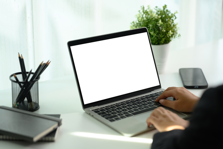 Cropped shot of businesswoman hand typing on laptop keyboard