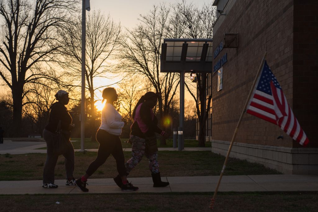 TOPSHOT - Last-minute voters arrive to cast their vote during Missouri primary voting at Johnson-Wabash Elementary School on March 15, 2016 in Ferguson, Missouri. (Photo by Michael B. Thomas / AFP) (Photo by MICHAEL B. THOMAS/AFP via Getty Images)