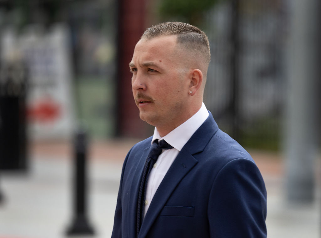 Tyler Laube, of Redondo Beach, walks to the entrance to the Ronald Reagan Federal Courthouse in Santa Ana