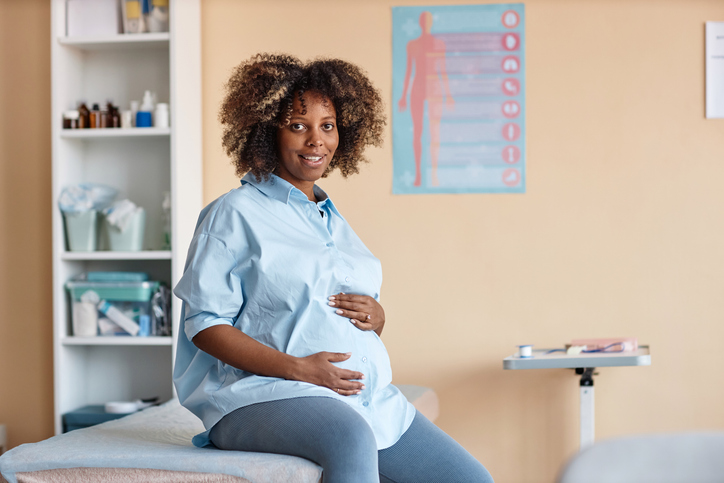 Pregnant Woman Smiling at Camera