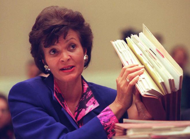 US Energy Secretary Hazel O'Leary holds up the rat