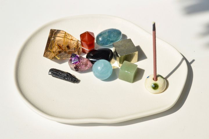 Crystal Healing: crystal bowl - a bowl filled with small crystal with incense burning