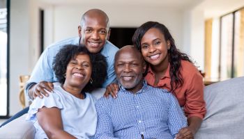 Two generation family smiling at home