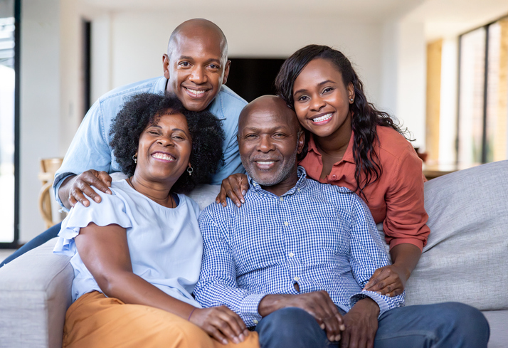 Two generation family smiling at home