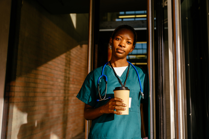 Portrait of serious tired African American doctor during break