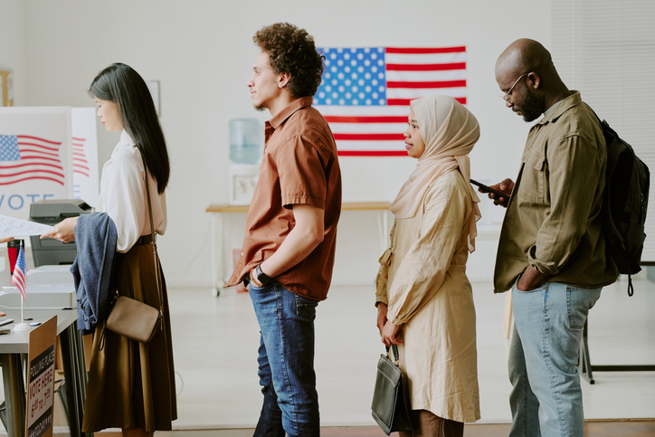 Young People Standing In Line At Polling Station