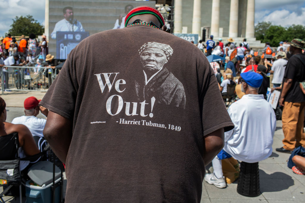 A civil rights supporter wearing a Harriet Tubman T-Shirt,...