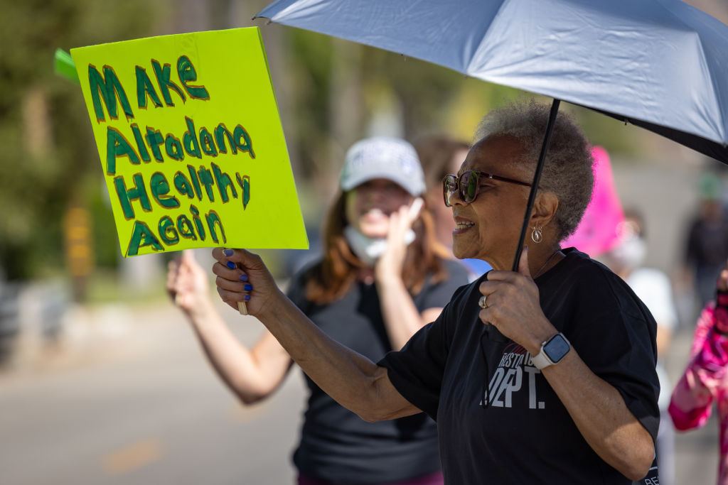 A group of Altadena residents whose homes survived the Eaton fire gather to rally against the concrete recycling operation planned at the Altadena Golf Course...