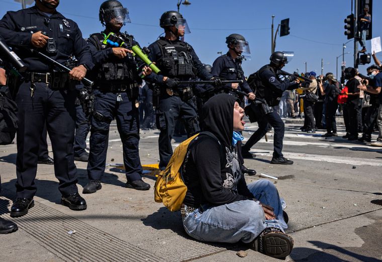 Protesters clash with law enforcement in downtown Los Angeles near the Federal Building and the Metropolitan Detention Center due to the immigration raids in LA.