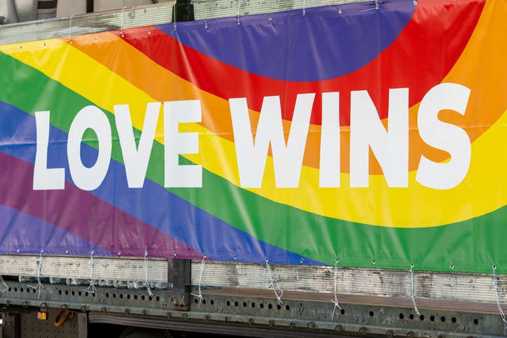 Truck with rainbow coloured banner