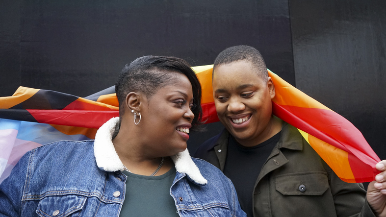 Two women with pride flag