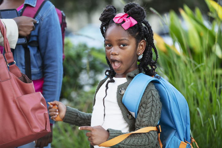 Playful African-American girl before or after school