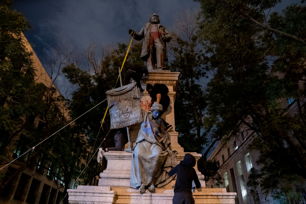 WASHINGTON,DC-JUNE19: Protestors prepare to remove a statue of