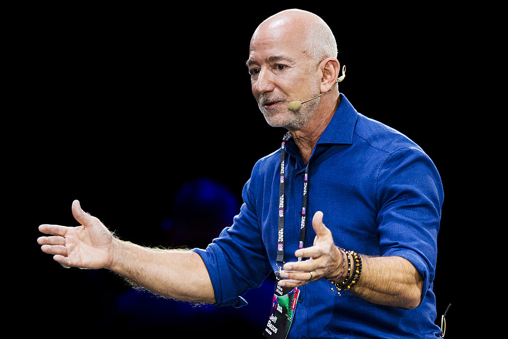 Jeff Bezos, founder of Amazon, speaks on stage during the...