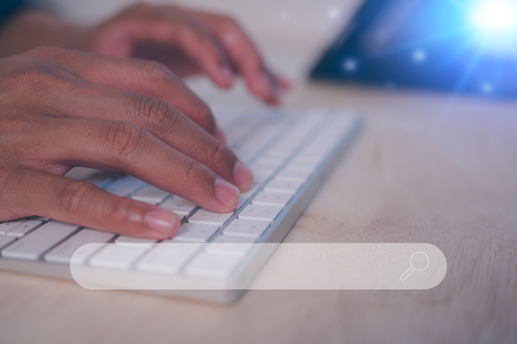 Man hands typing on wireless computer keyboard, Document data system Report HR technology Concept Utilizing search engines for comprehensive research and SEO data analysis. FaaS