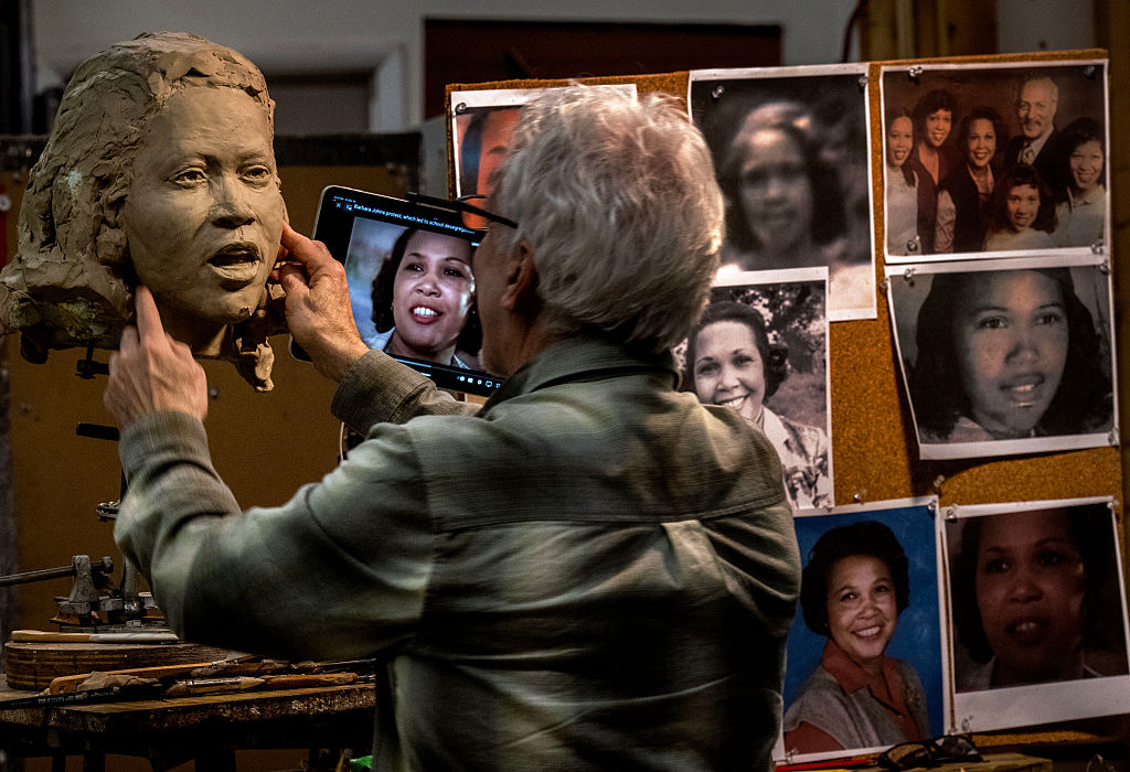 Steven Weitzman, who is sculpting a statue of Barbara Rose Johns to replace Robt. E. Lee in the Capitol, works with surviving family membes on her likeness in his studio on March 24 in Mt. Ranier, MD.