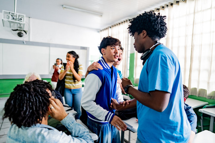 Students in argument or disagreement in classroom