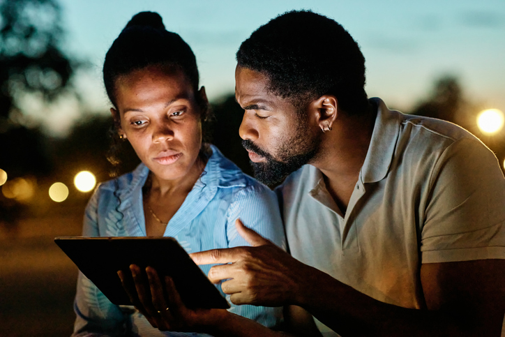 woman technology connection tablet online man couple television watching movie entertainment horror girlfriend boyfriend