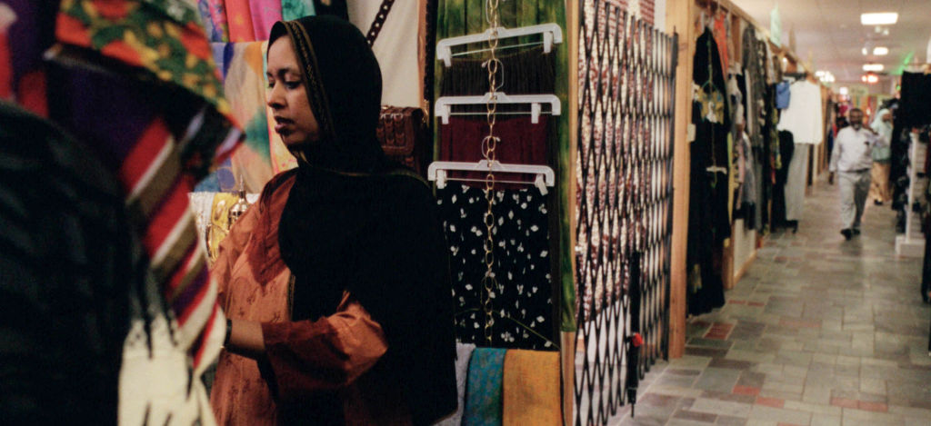 Anab (cq) Abdirhman(cq) looks for farbic at a shop in mini-mall that caters to Somali shoppers in south Minneapolis. The mall opened 3-months ago, and offers clothing boutiques, perfumeries, a barber shop, tailor shop, and other stores that sell Somali go