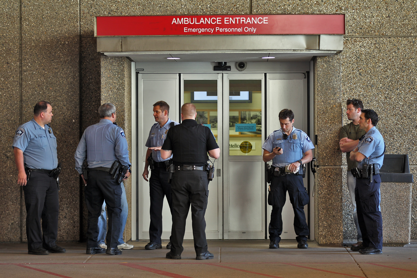 Activities at Hennepin County Medical Center after two Minneapolis policemen shot. Police officers stood outside an emergency room entrance. (MARLIN LEVISON/STARTRIBUNE(mlevison@startribune.com (cq )