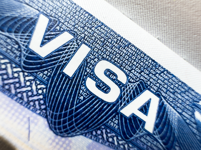 US visa, Visa in passport, fee for US visa, tour of the USA, airport, customs, checkpoint, illegal immigrants, closed borders, nationality H-1B visa. Macro photo