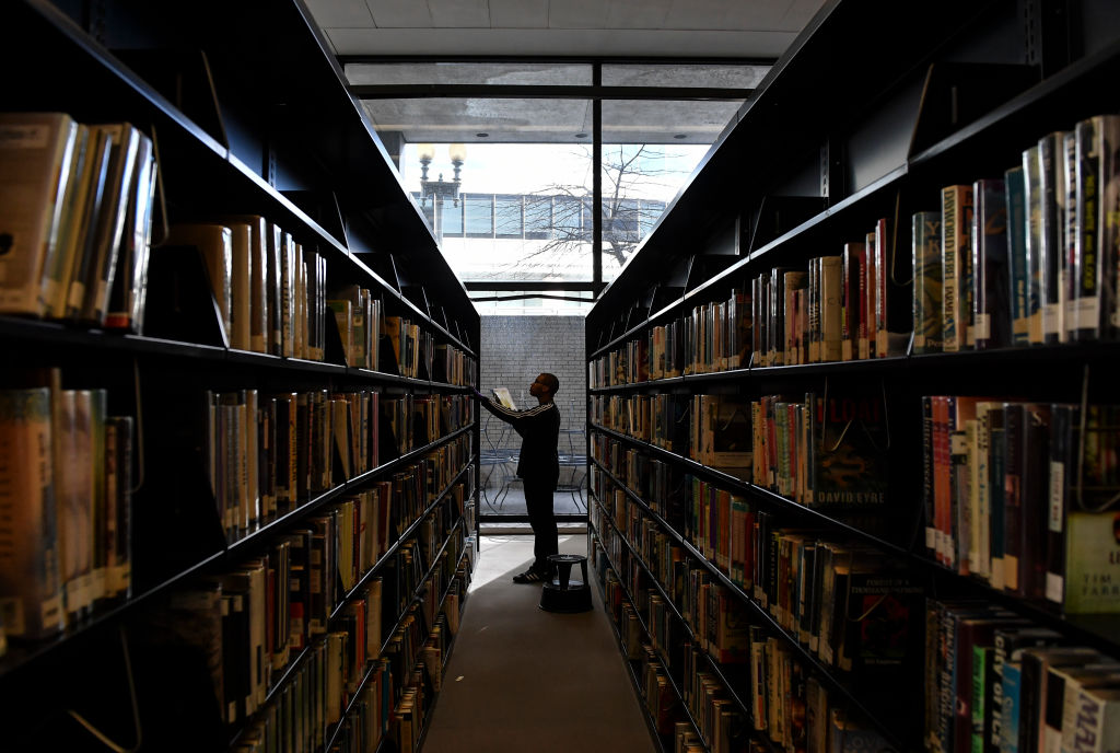 WASHINGTON, DC - MARCH 8: Library associate Caleb Bess pulls bo