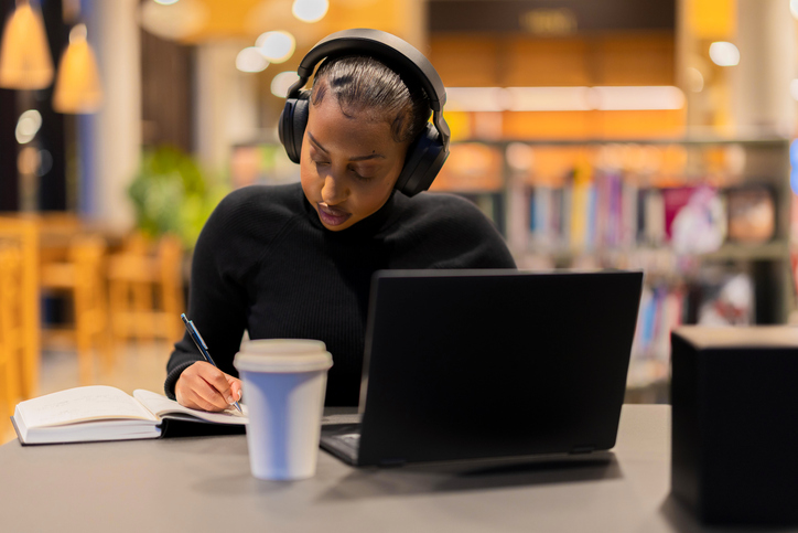 Student studying diligently in a library