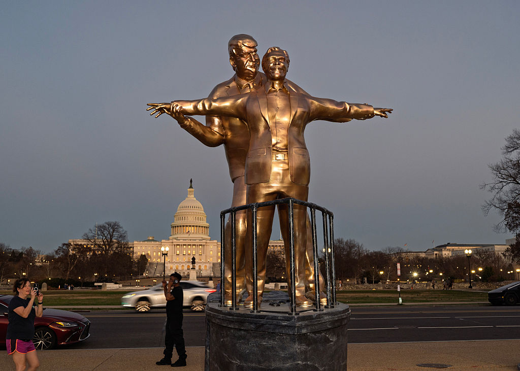 A statue titled "King of the World," depicting President