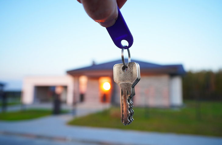 Keys for new house. Keys for house facade after buying. Buying suburb home, villa rent.