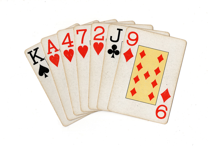 A hand of old playing cards.