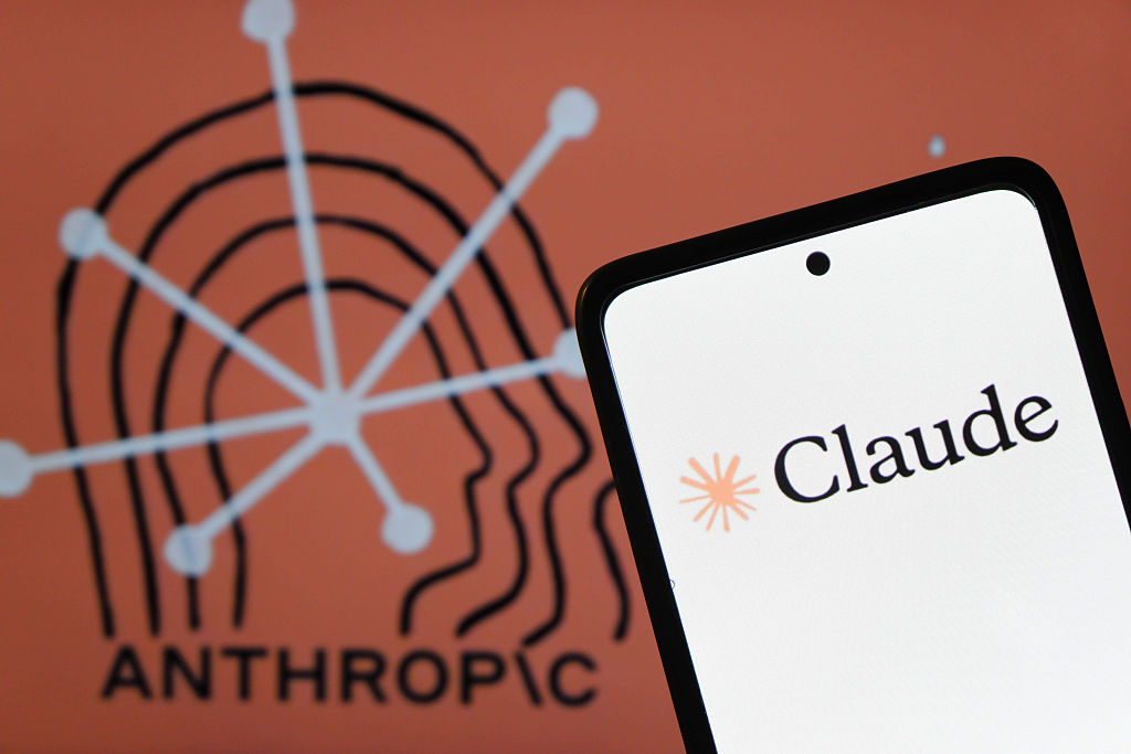 In this photo illustration, the Claude AI logo, an