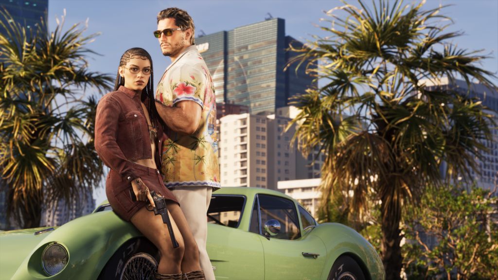 Two people standing next to a green vintage car in a city with palm trees.