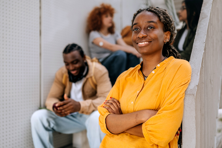 Portrait of smiling female university student on campus