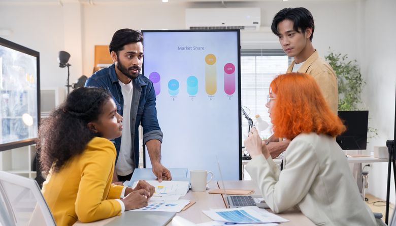 Diverse business team meeting in modern office to discuss sustainability, ESG goals, and eco-friendly strategies focused on green initiatives, environmental responsibility, and corporate ethics.