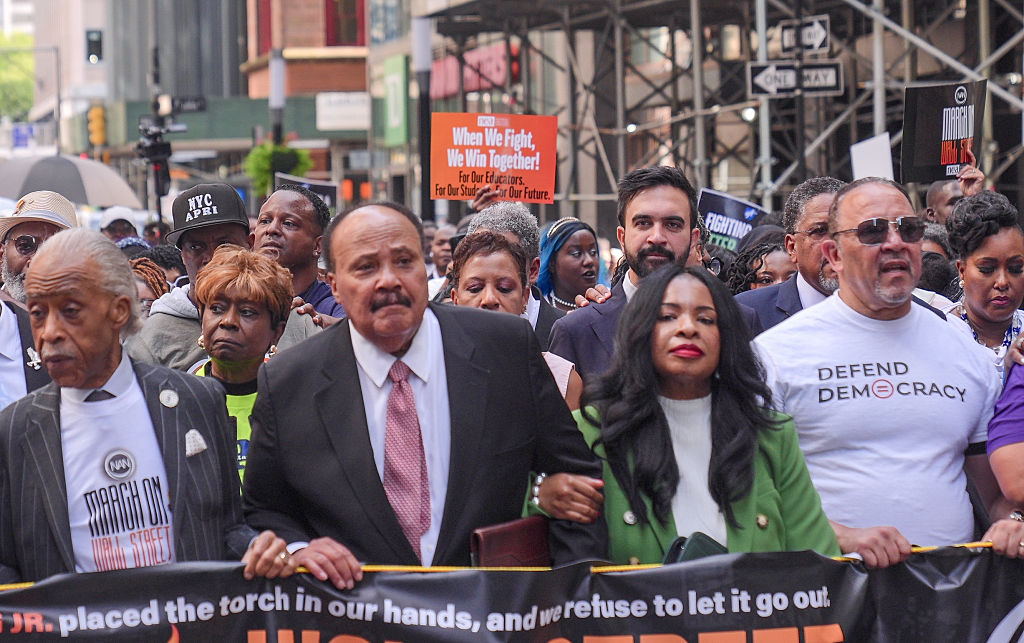 Demonstrators march for economic justice to Wall Street in New York City